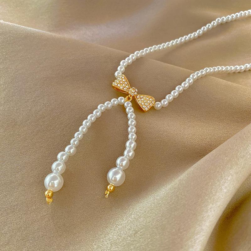 Pearl necklace - trendy, instagram-worthy bow pendant - designer, versatile choker