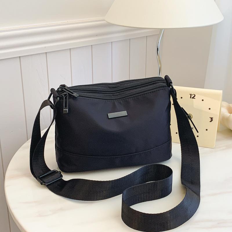 

Simple solid color nylon messenger bag women s fashion new supply casual large capacity multi-compartment shoulder bag чёрный