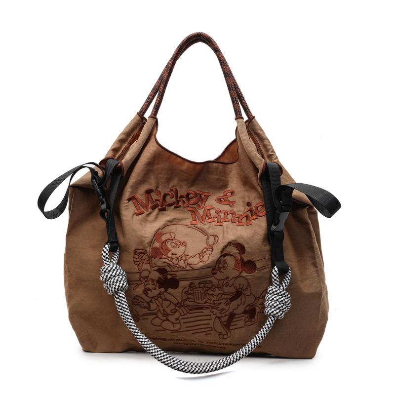 

2025 casual art canvas bag fashion cartoon embroidery handbag large capacity Mickey shoulder bag women s bag