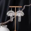Bohemian Ethnic Miao Silver Tassel Earrings with Butterfly, Peacock, and Flower Design for Women – Long Dangle Jewelry for Travel Photos.
