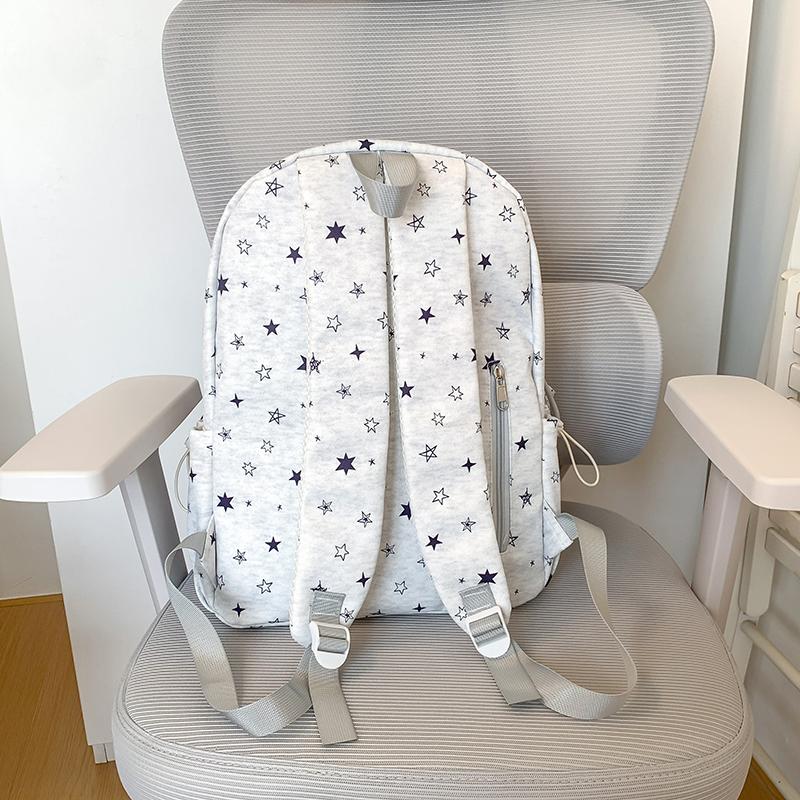 Star-Printed Backpack with Front Zipper Pocket and Tassel Details for School and Daily Use