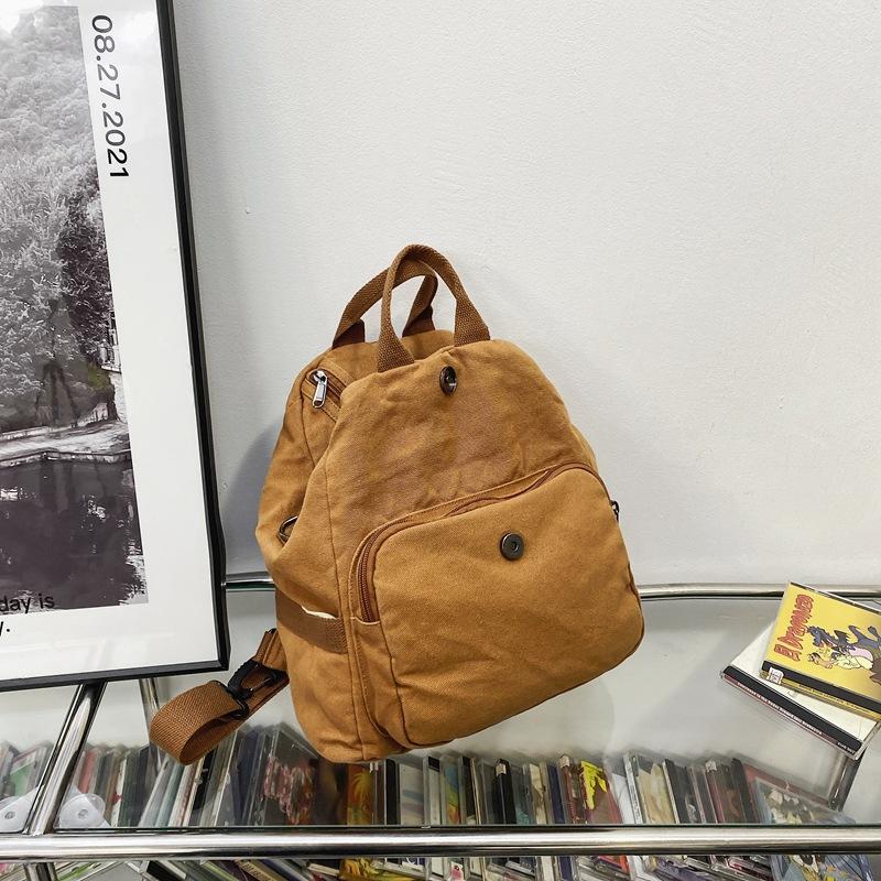 

ins new Japanese niche Harajuku design sense literary canvas backpack student class solid color variable shoulder коричневий