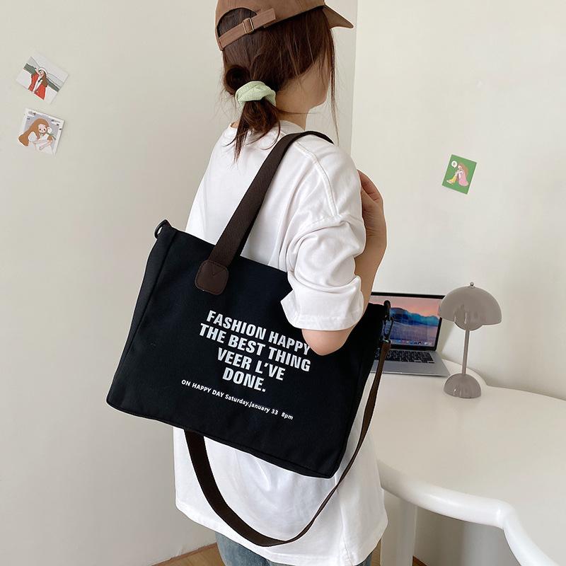 2025 new trendy simple portable canvas bag large capacity leisure shoulder bag college student shopping bag tote bag