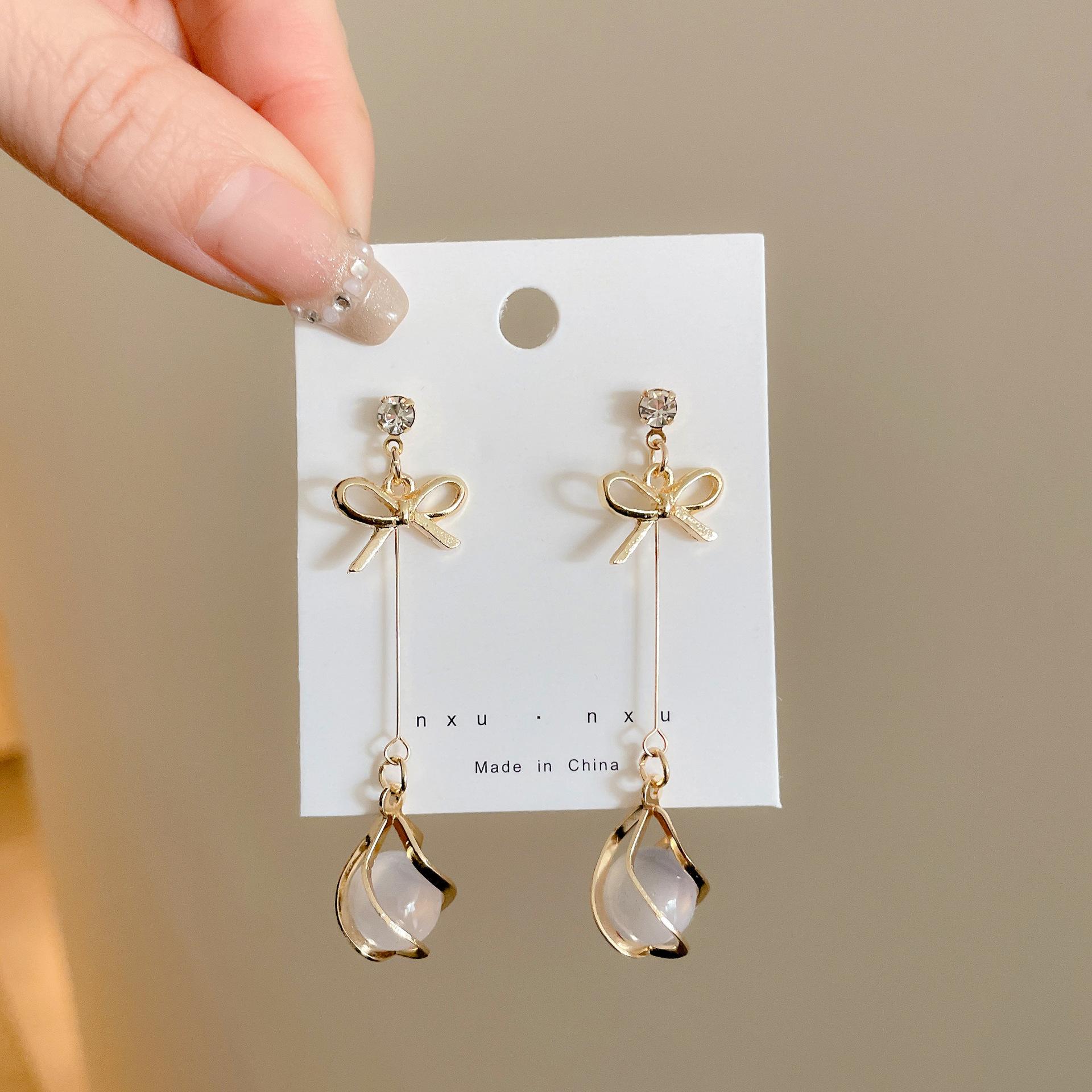 

Opal Pendants Women s Hanging Earrings Hollow Bowknot Crystal Korean Fashion Shiny Sweet Dangle Earrings for Ladies Zircon