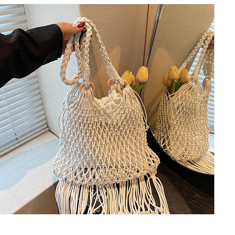 New Straw Bag Handbag Diagonal Span Hollow Women's Bag Beach Bag Single Shoulder Fashion Hollow Fringed Armpit Bag