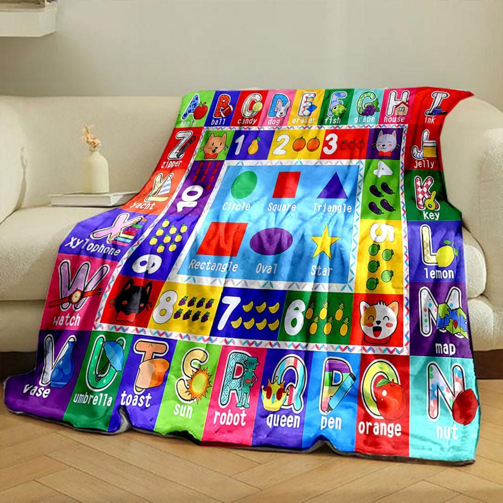 The pattern consists of letters, numbers, shapes, and corresponding images. for all seasons blanket lunch break throw gift