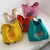 Solid Color Canvas Tote: Large Capacity Fashion Handbag with Artistic Letter Design