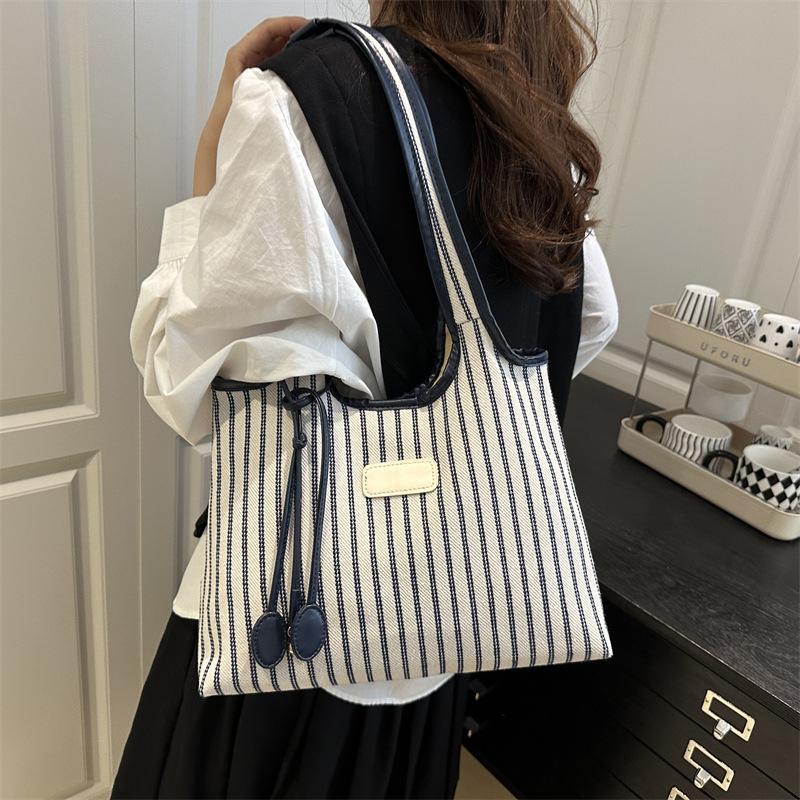 2025 New Niche Shoulder Bag Striped Simple Tote Bag Simple Versatile Portable Color Matching Armpit Bag