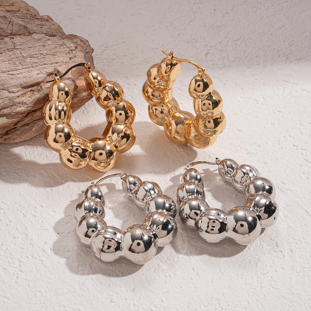 Metal light-sensitive surface geometric round U-shaped ear buckle niche environmentally friendly fashion earrings