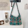 New tie-dye plaid one-shoulder messenger bag, flip zipper canvas bag, large-capacity commuter underarm bag.