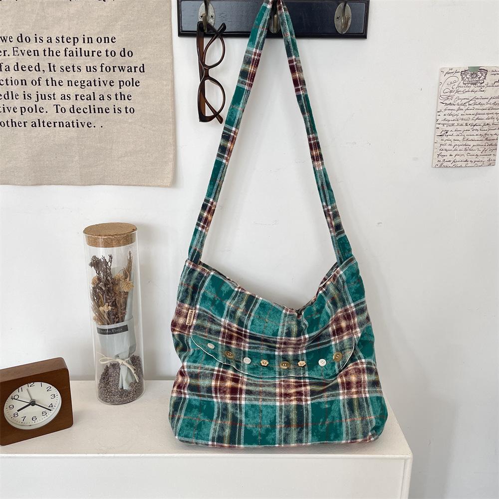 New tie-dye plaid one-shoulder messenger bag, flip zipper canvas bag, large-capacity commuter underarm bag.