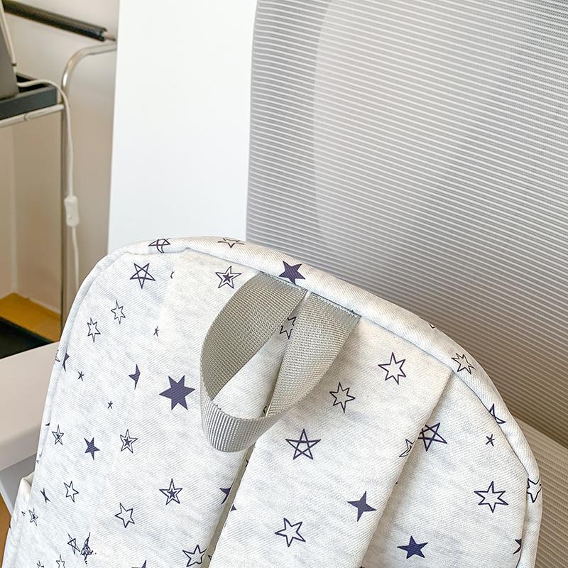 Star-Printed Backpack with Front Zipper Pocket and Tassel Details for School and Daily Use