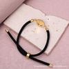 Micro-Paved Colored Zircon Madonna Bracelet with Gold-Plated Copper, Adjustable Cotton Cord.