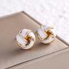 Light luxury high-end French retro concentric knot earrings design temperament versatile New Year's earrings autumn and winter earrings