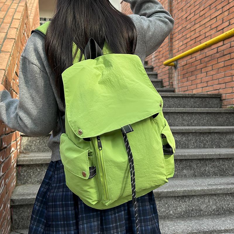 2025 new Korean niche casual simple style solid color backpack women's commuting versatile large-capacity student schoolbag