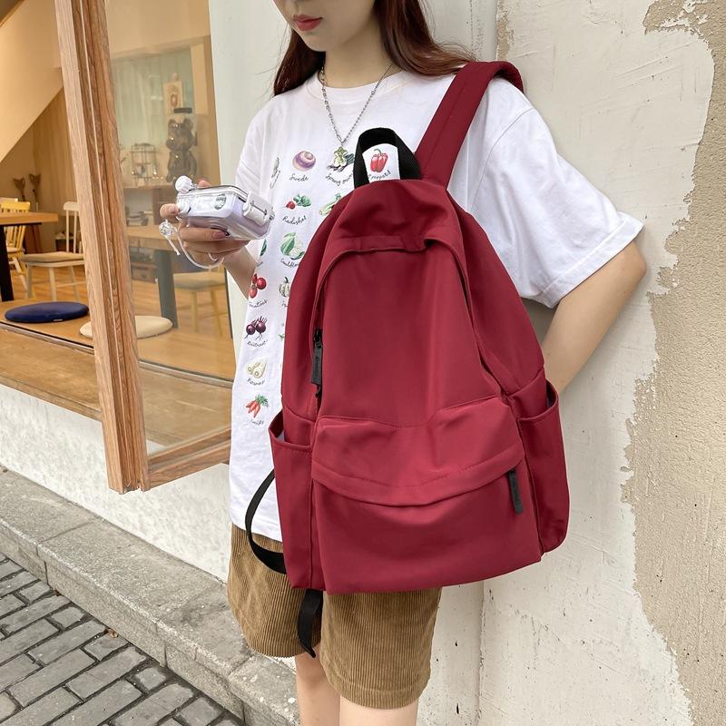 Schoolbag backpack ins trendy new Korean version of female high school junior high school students large capacity simple solid color schoolbag male