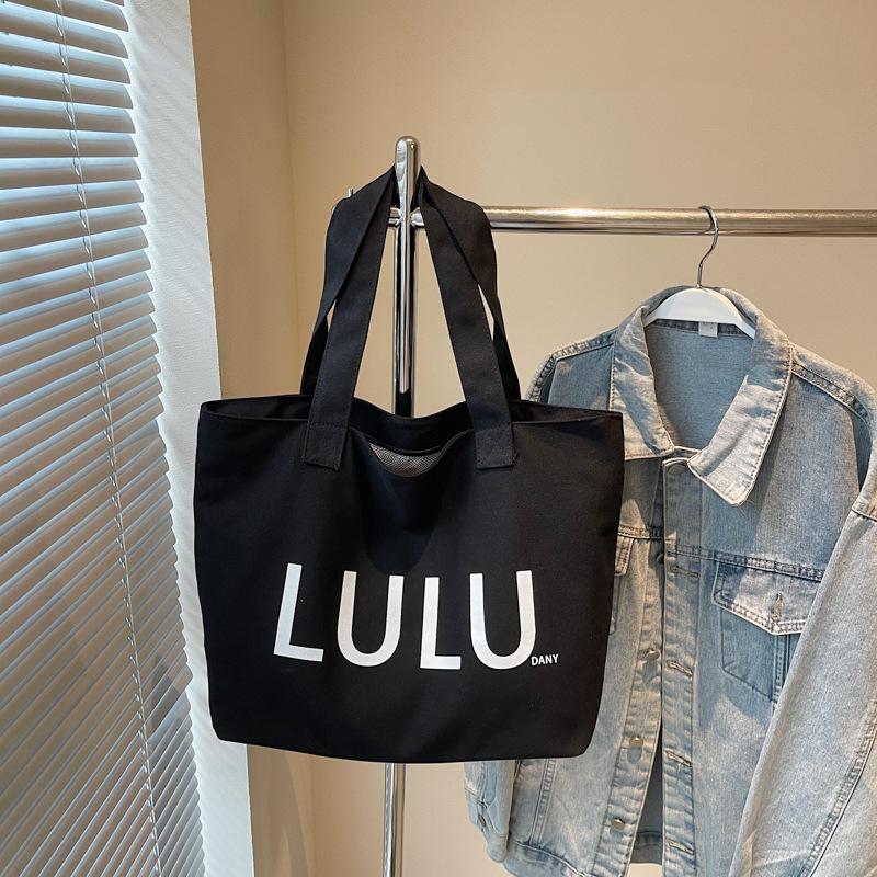 Casual large-capacity canvas bag women's new fashionable versatile shoulder bag class commuter tote bag