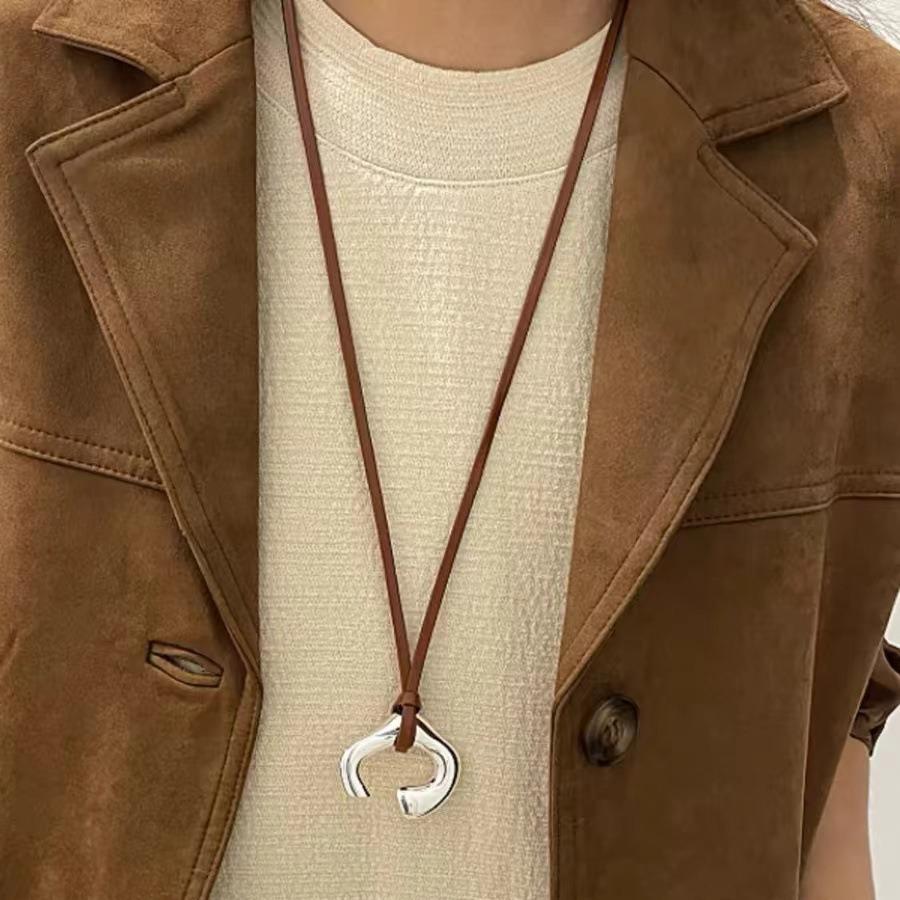 Brown Leather Cord Necklace with Silver Abstract Human Body Pendant – Autumn/Winter Light Luxury Clavicle Chain