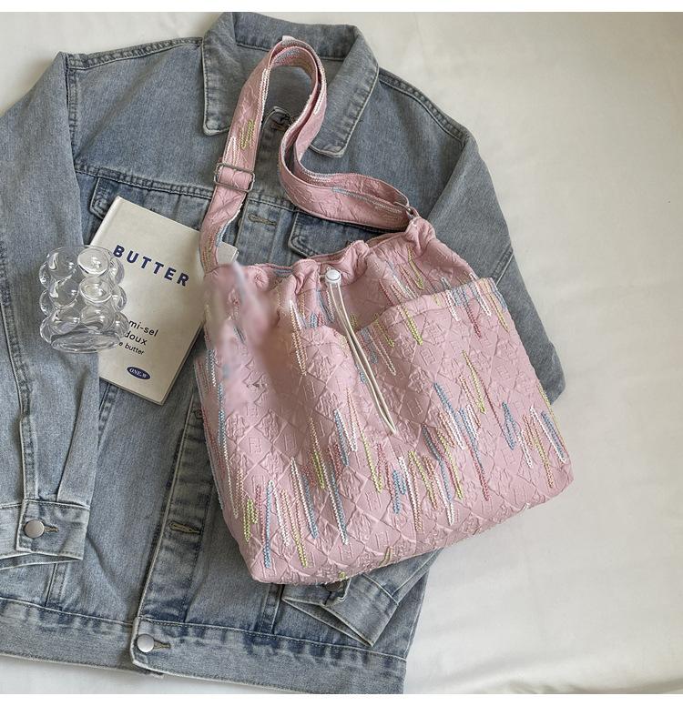 

Versatile canvas bag women s 2024 new summer tote bag casual commuter shoulder bag large capacity messenger bag tide