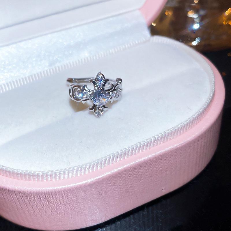 Sparkling zircon cross iris flower ear clip women's no ear piercing exquisite ear bone clip light luxury high-end versatile earrings