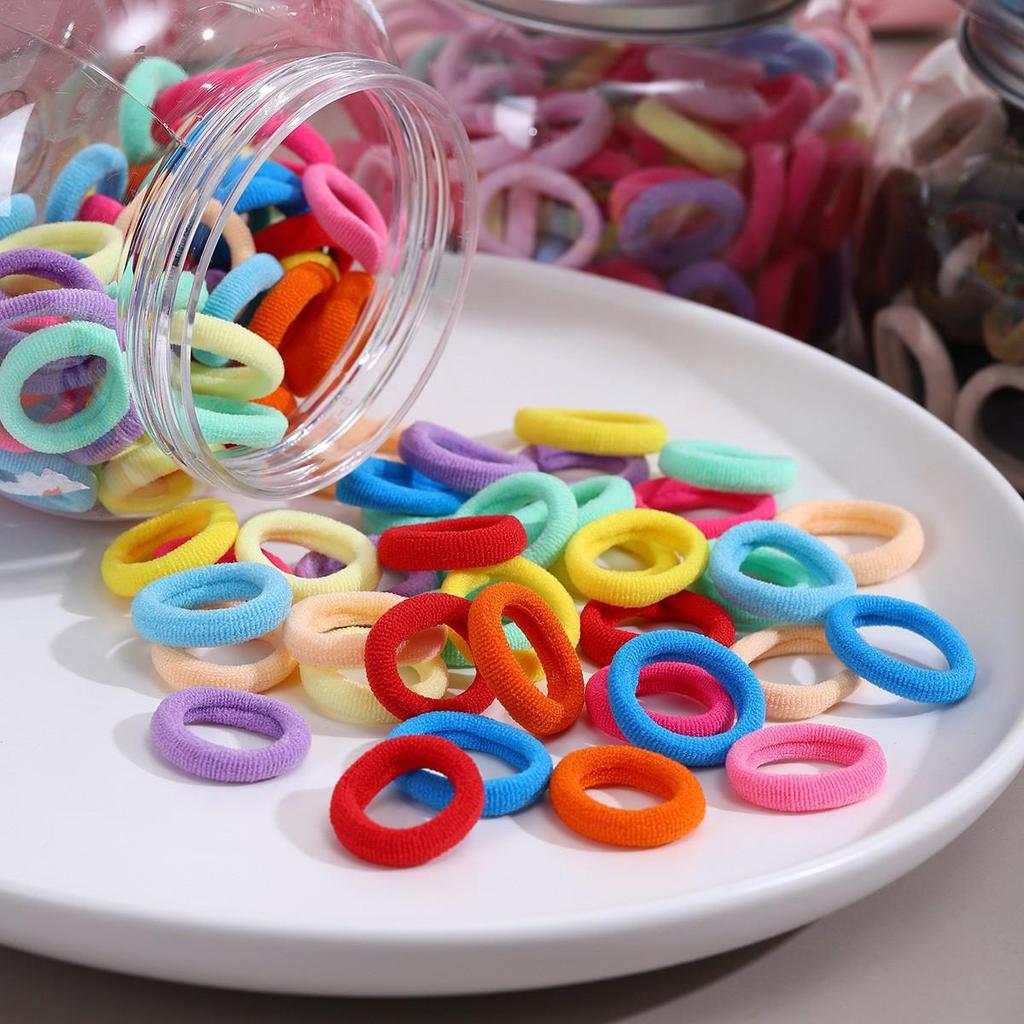 Non-damaging, High-elasticity, Colorful Hair Ties for Kids and Babies, Sized for Tiny Thumbs and Perfect for Girls' Towel Loops.