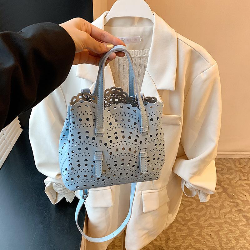 Niche design new engraved portable tote bag summer shoulder hollow vegetable basket bag women's bag messenger bag