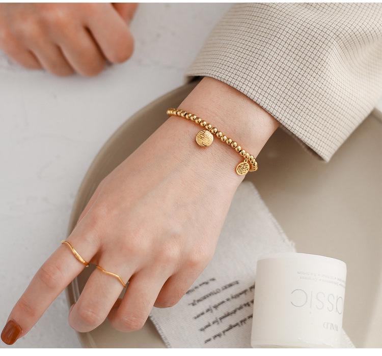 Japonsko-korejský 3D náramek z titanové oceli se zlatými postavami Fu a Xi a tykví - Jednoduchý, elastický design