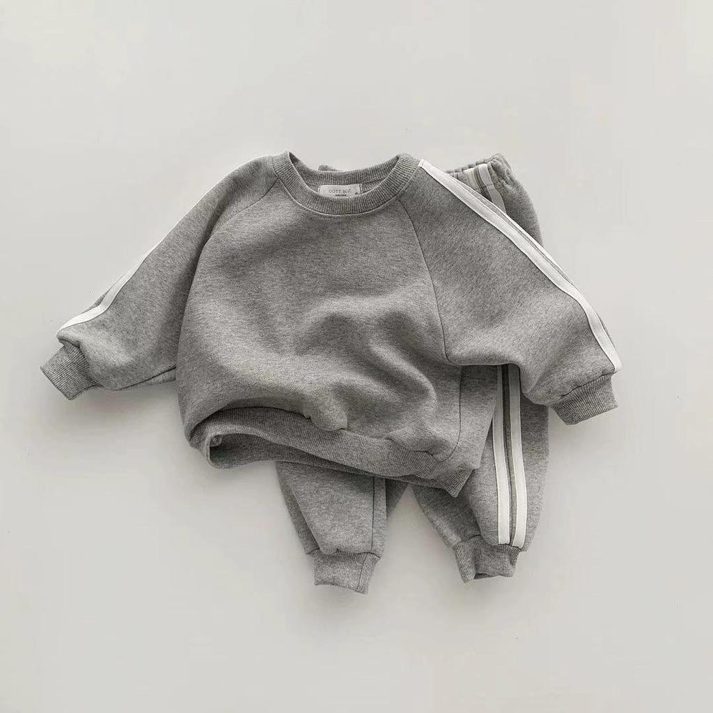 Korean-Style Unisex Baby Sweatshirt and Pants Set - Solid Color with Webbing Stripe Patchwork for Autumn and Spring.