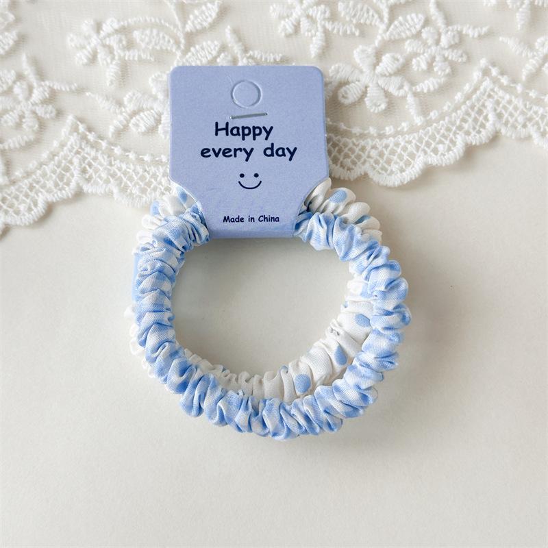 

A Light and Fresh Floral-patterned Polka-dot Small Hairband for Girls, with A High-elasticity Rubber Band for The Bun Hairstyle. Blue and white polka dots