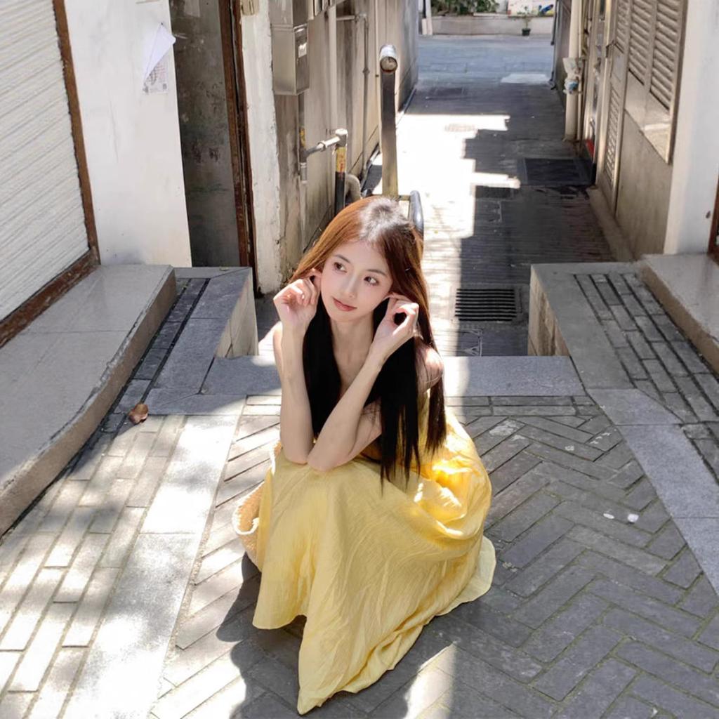 Seaside vacation travel Thailand super beautiful yellow suspender dress women's summer gentle wind waist French long skirt