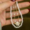 Echtgold-Galvanisierung tropfende Kamelienperle zweiteiliges Set Armband elegantes Armband Nischen-Design Schmuck Damen