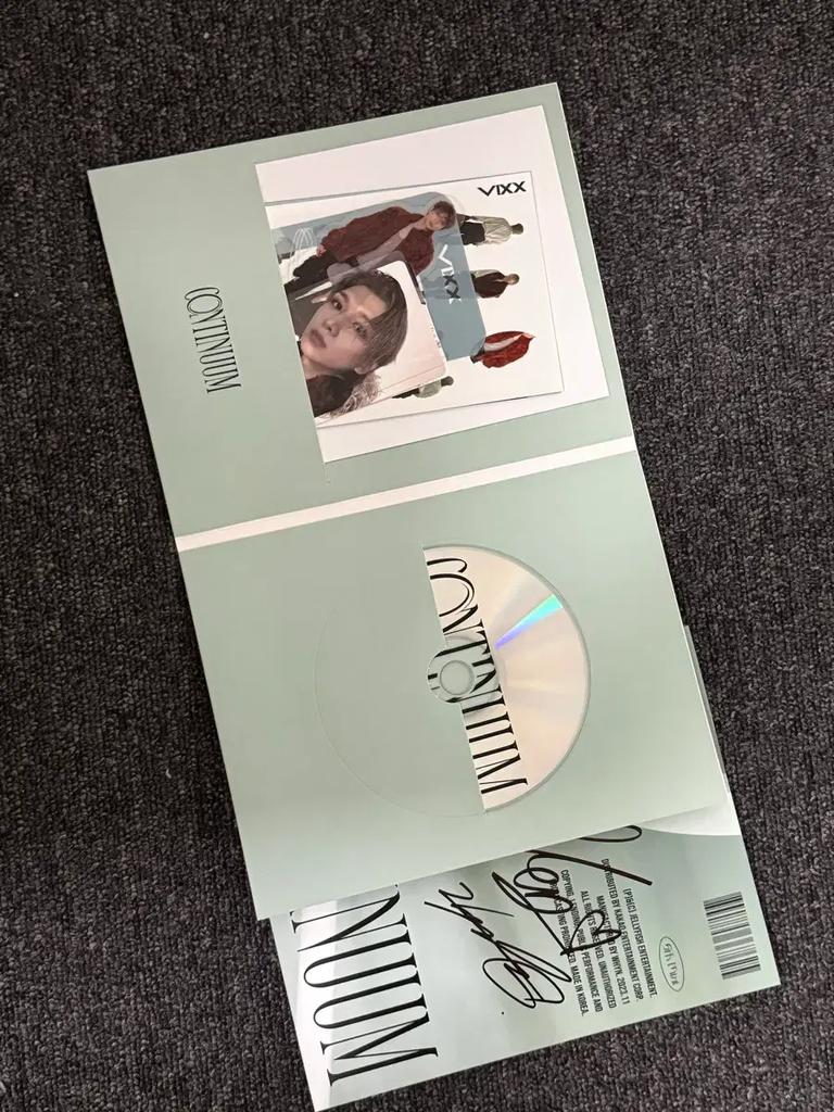 VIXX Continuum album with handwritten signatures for sale.
