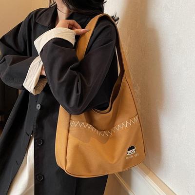 Women's Simple Embroidered Canvas Tote: 2026 New Small Niche Design, Handheld & Shoulder Bag, Large Capacity.