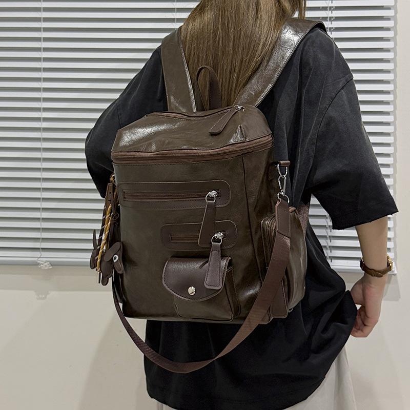 Schoolbag European and American retro silver nail-trimmed backpack couple high street locomotive wind light and versatile class storage backpack