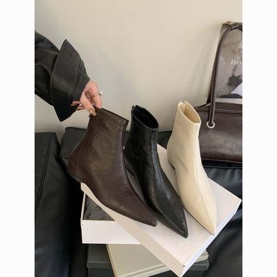 Bottes courtes pointues, bottes élastiques de rue à la mode montrent la longueur des jambes, augmentent la hauteur, bottes nude fines et de grande valeur