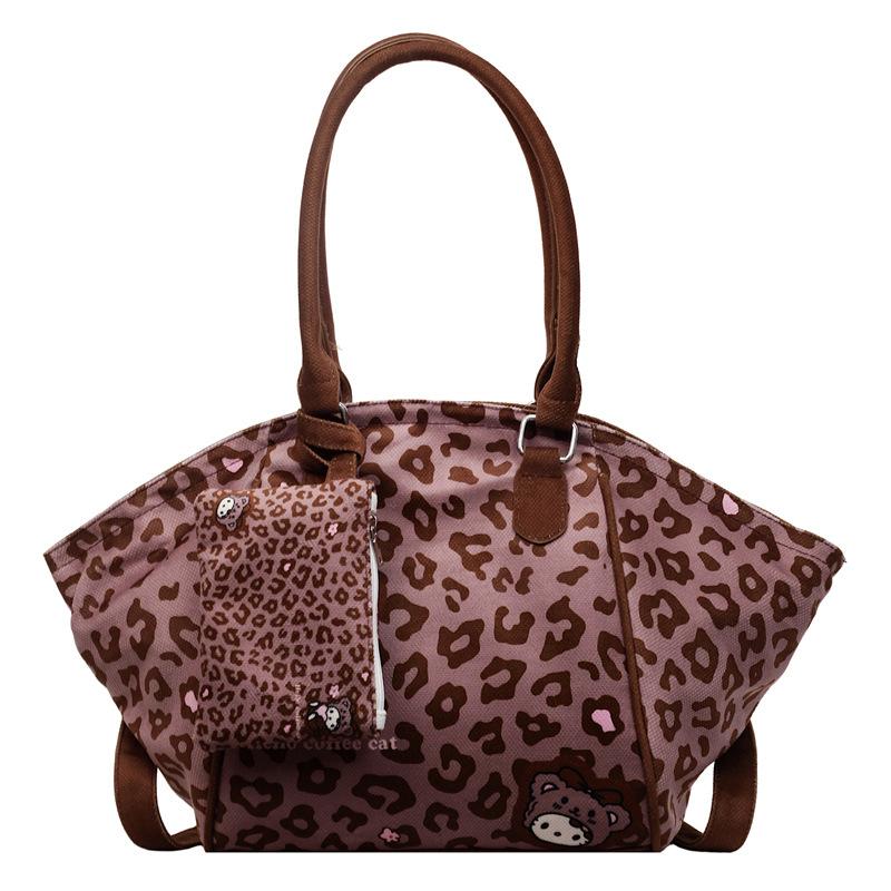 

Autumn new personalized cartoon print contrasting color women s pocket tote bag shoulder armpit bag темно-коричневого кольору
