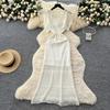 Wear women's high-end sense hollow crochet waist small fly sleeve knitted dress with suspender skirt two-piece set