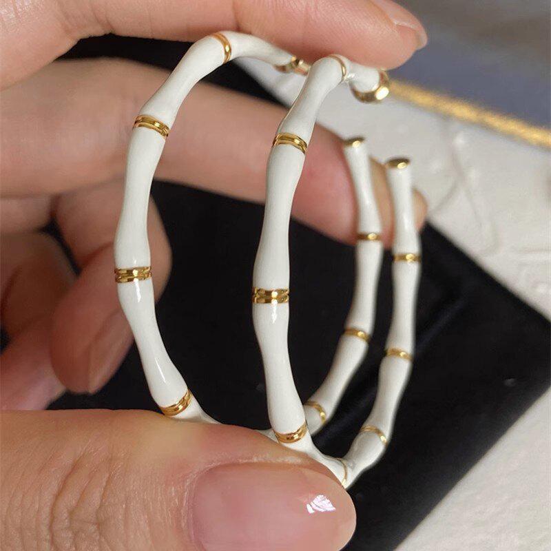 

Huitan Modern Fashion Bamboo Shaped White Enamel Hoop Earrings for Women Temperament Lady Accessories Daily Wear Trendy Zircon