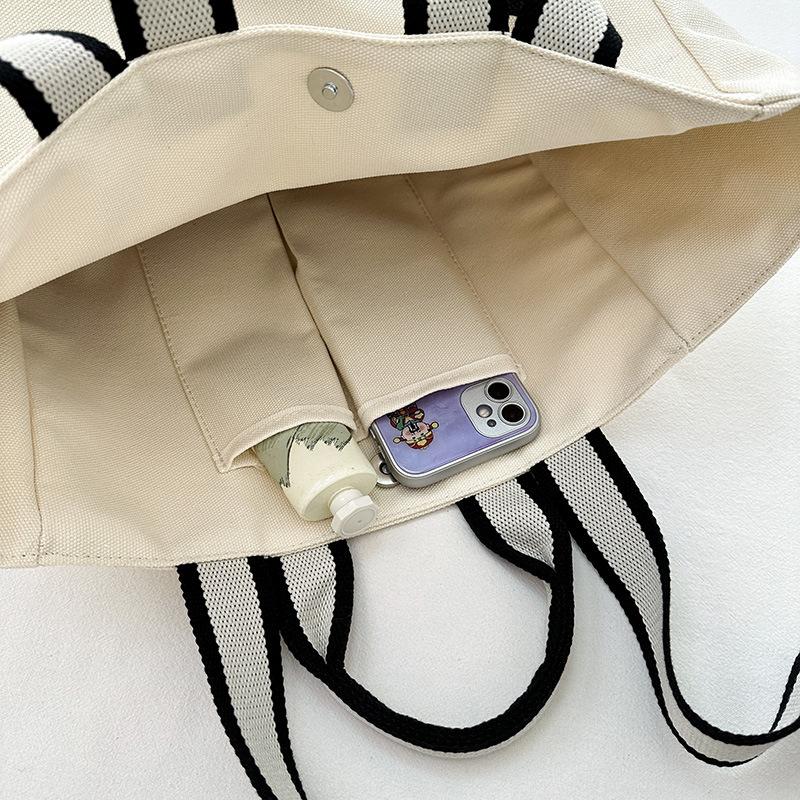 Shoulder bag women's 2025 autumn new trend large-capacity tote bag fashion simple college style commuter canvas bag