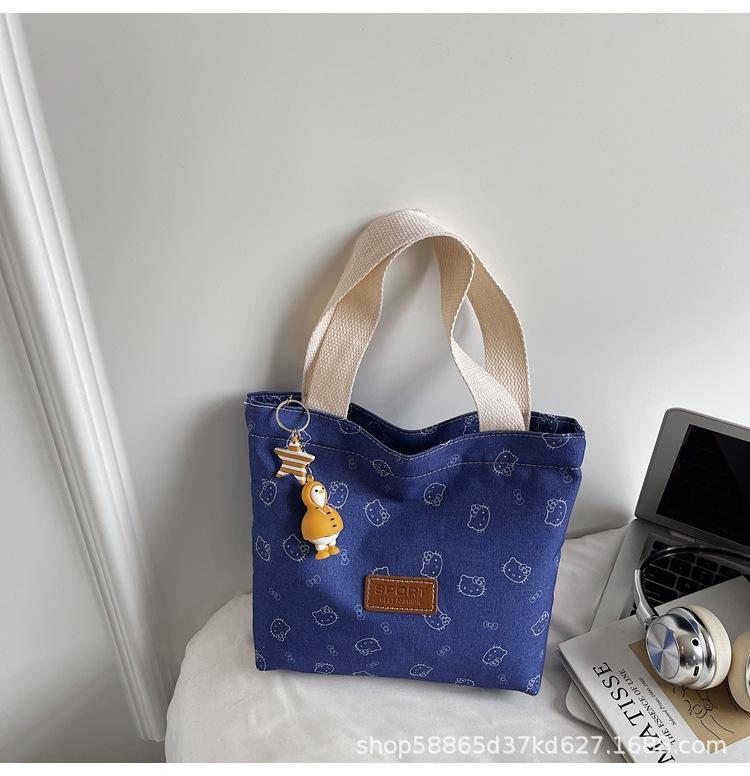 

Go out portable new bag large capacity canvas bag water cup Korean embroidery kitten hand bag KT cat bucket bag no charm included