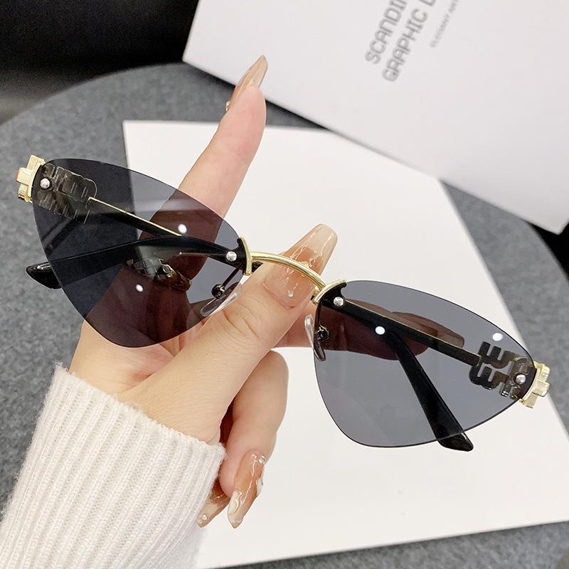 Miao's Frameless Cat-Eye Sunglasses: Women's High-End European & American Style with Hollow Letter Design.