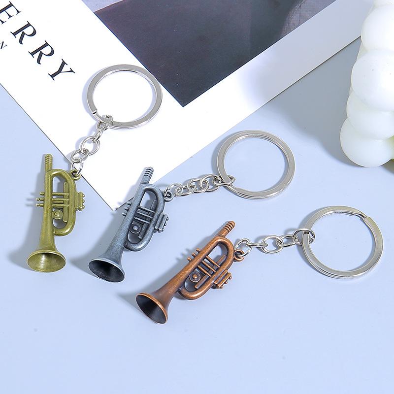 Mini nástroj Saxofon Přívěsek na klíče do auta Mini hudební nástroj Kovový kroužek na klíče Příslušenství Přívěsek na tašku Dárky na hudební festival