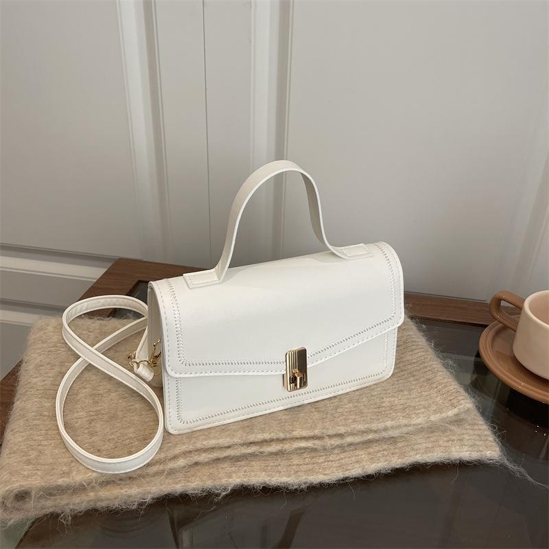 

Иностранный стиль личность текстура простой нишевый дизайн маленькая квадратная сумка 2025 зима новая повседневная женская сумка через плечо белый