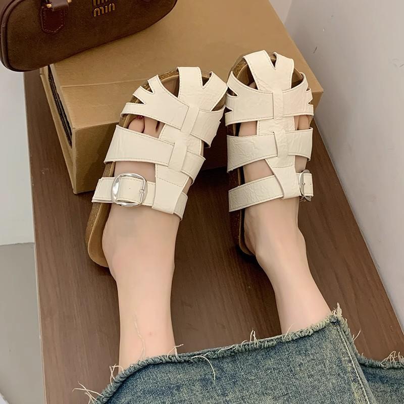 Leather baotou women's new summer hollowed-out woven one-pedal outer wear half-drag casual cool slippers