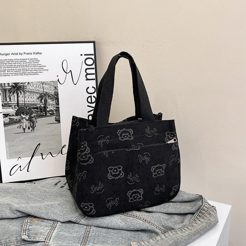 

New fashion handbag, beautiful, casual, light and large-capacity handbag, trendy cartoon printing, cute storage bag чёрный