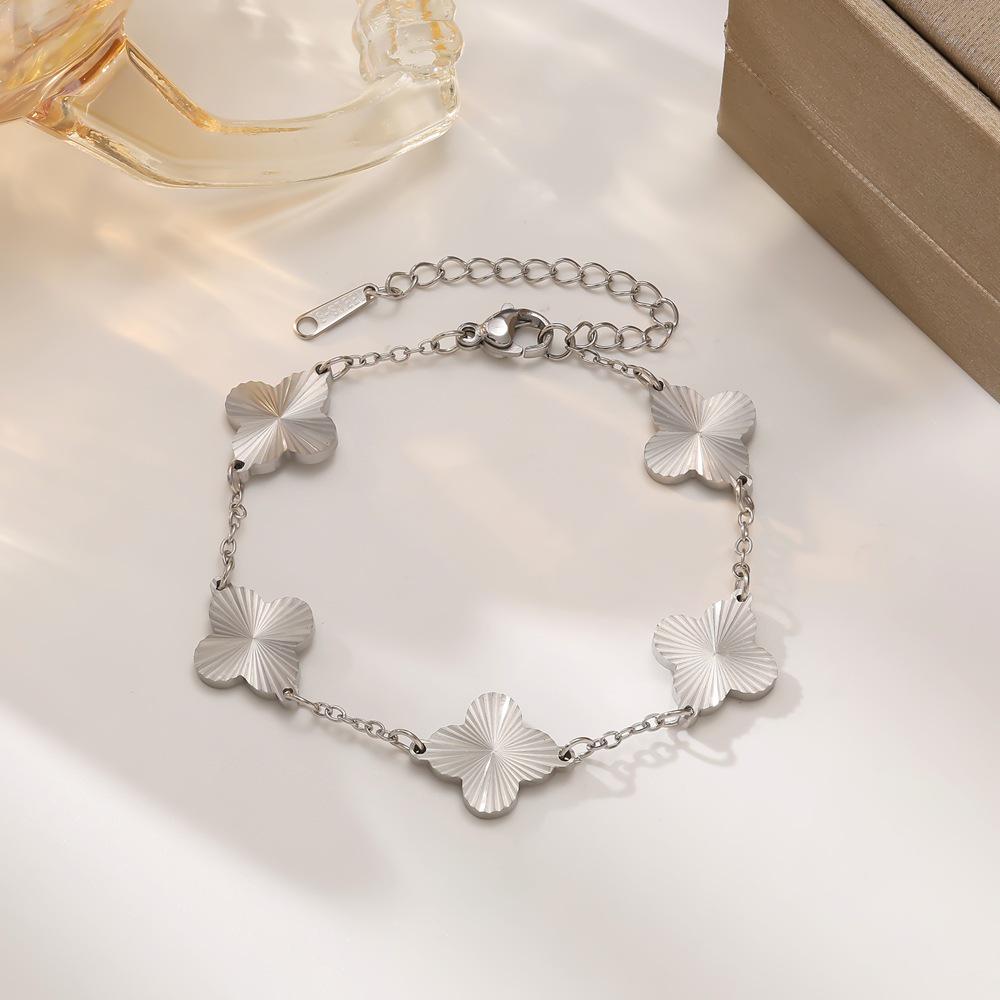 18K Gold Four-Leaf Clover Hollowed Titanium Steel Bracelet for Women