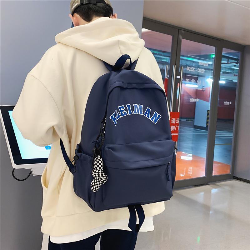 Schoolbag new schoolbag female Korean version simple college student high school student couple backpack Japanese design sense junior high school 