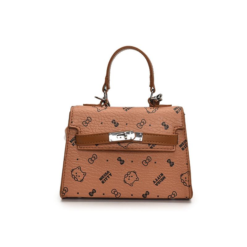 This year, the Korean version of the popular temperament cute printed portable Kelly bag niche light luxury versatile foreign style messenger wom