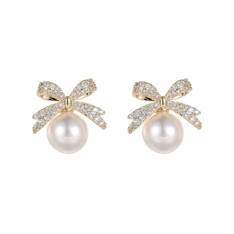 Light Luxury Niche Earrings, Japanese and Korean Exquisite and Sweet Pearl Stud Earrings, Fashionable Commuter Design Sense, Diamond-set Bow Earrings.