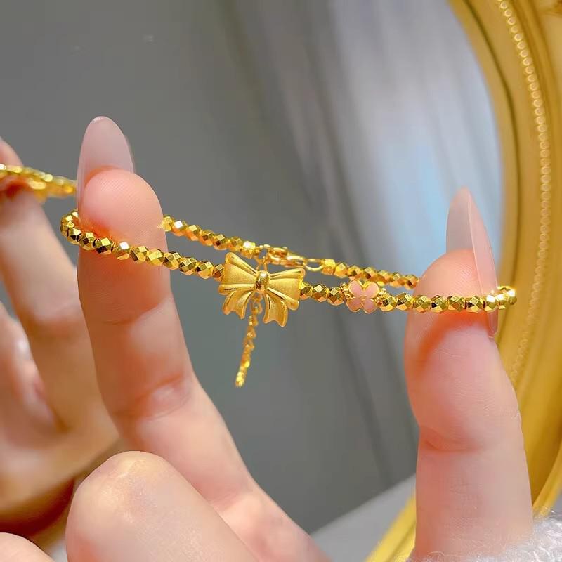 Exquisite Sterling Silver Bowknot & Peach Blossom Gold-Tone Bracelet with Super Sparkle Bead Design.